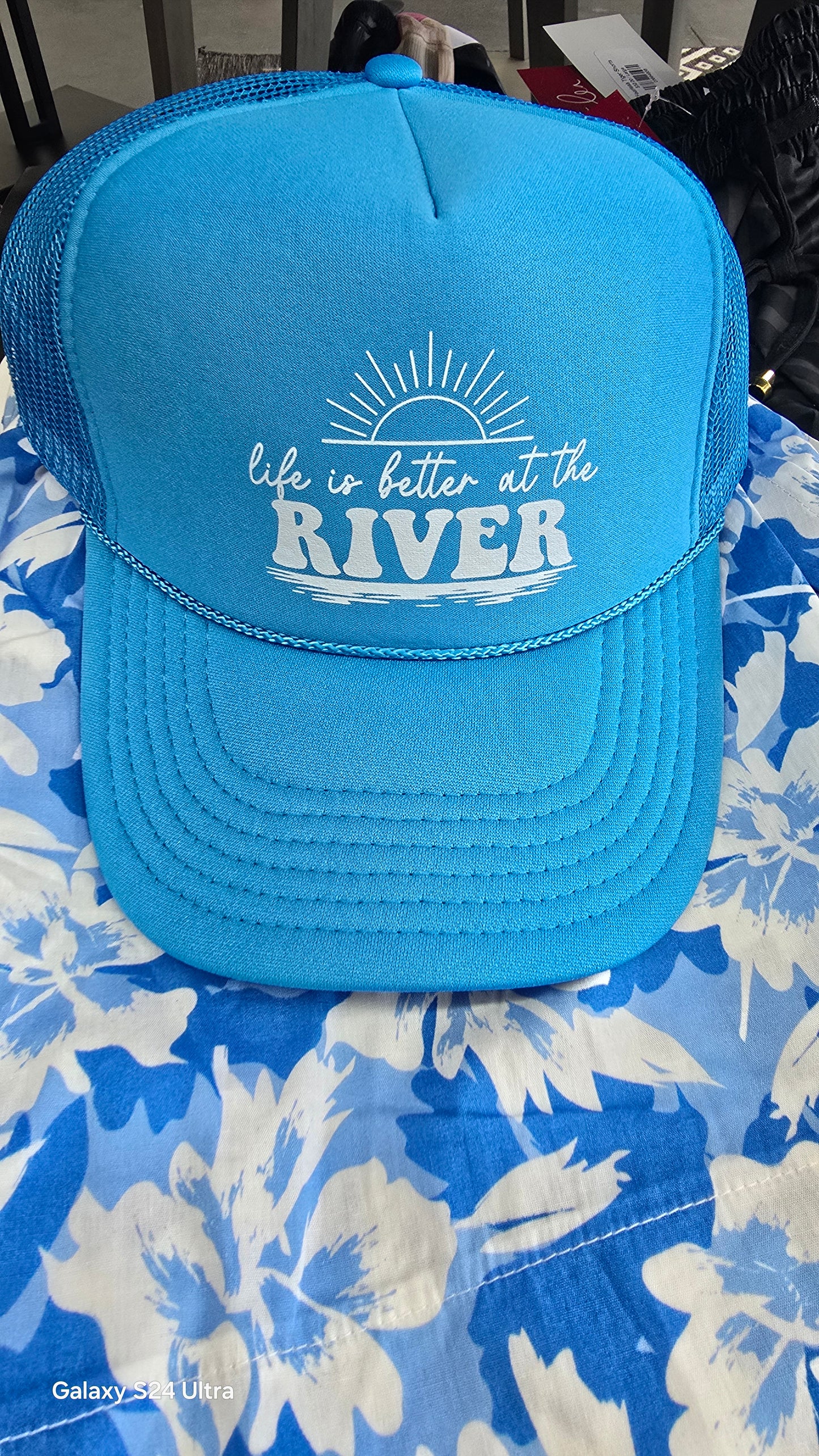 Life is better at the river trucker hat