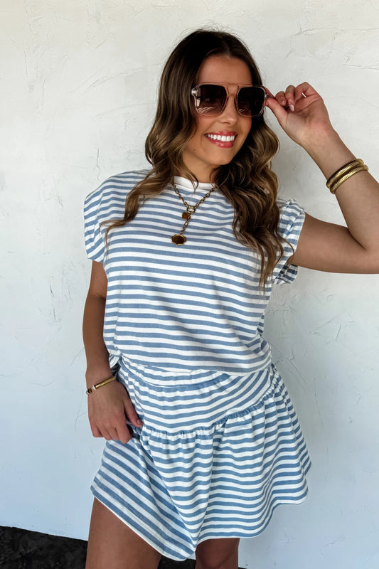 Woman wearing striped skort set in soft brushed fabric, sporty chic outfit