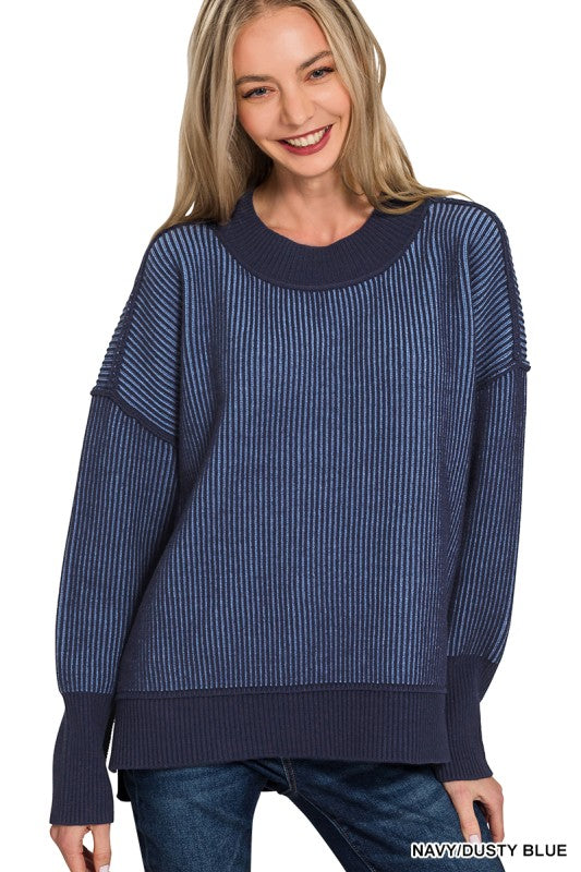 Exposed seam sweater for women in navy with high-low hem – front view